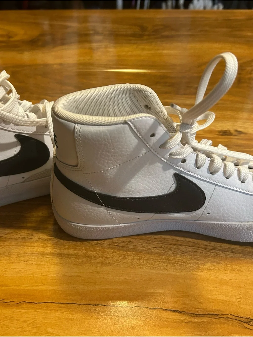 Nike White High-Top Sneakers with Black Swoosh